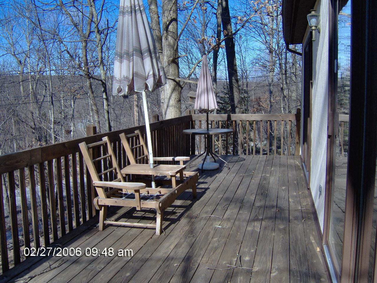 1243 Salsibury Road Bushkill, PA 18324 - Photo 8 of 8 a view of balcony with wooden floor and outdoor seating