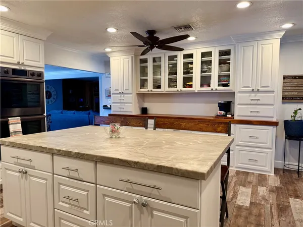 a kitchen with a stove and a refrigerator