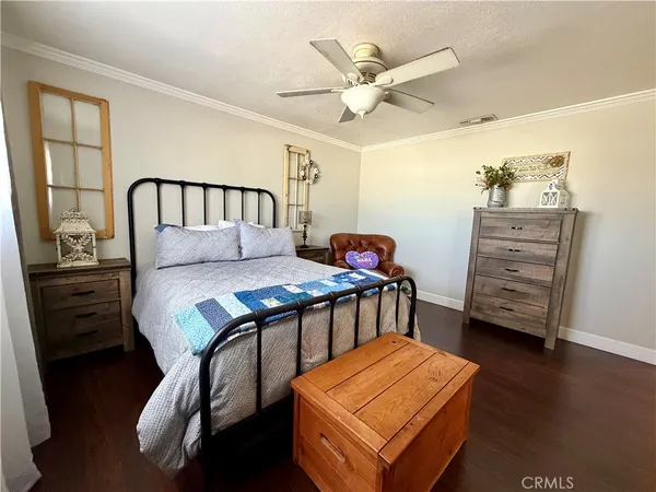 a bedroom with a bed and furniture