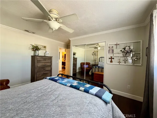 a bedroom with a bed and a dresser