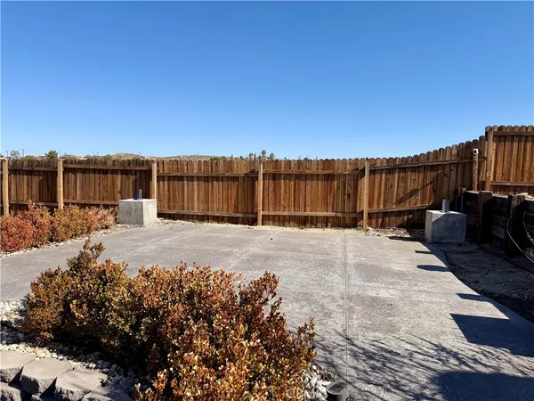 a view of a backyard of the house