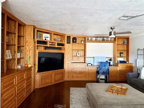 a living room with furniture fireplace and flat screen tv