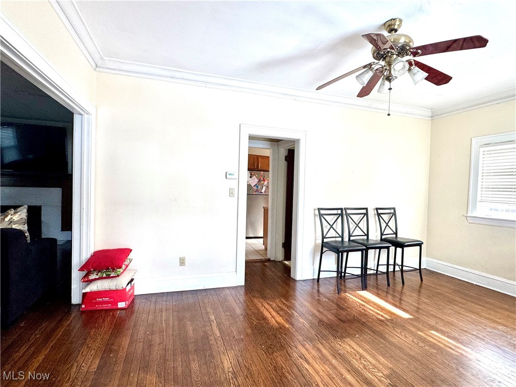 2152 Middlefield Road Cleveland, OH 44106 - Photo 25 of 50 Spare room with ceiling fan, ornamental molding, and dark hardwood / wood-style flooring