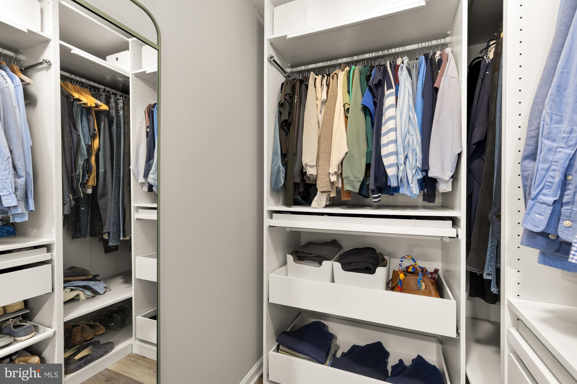 2221 Lovedale Lane, Unit 202B Reston, VA 20191 - Photo 15 of 27 a view of walk in closet with clothes and shoes