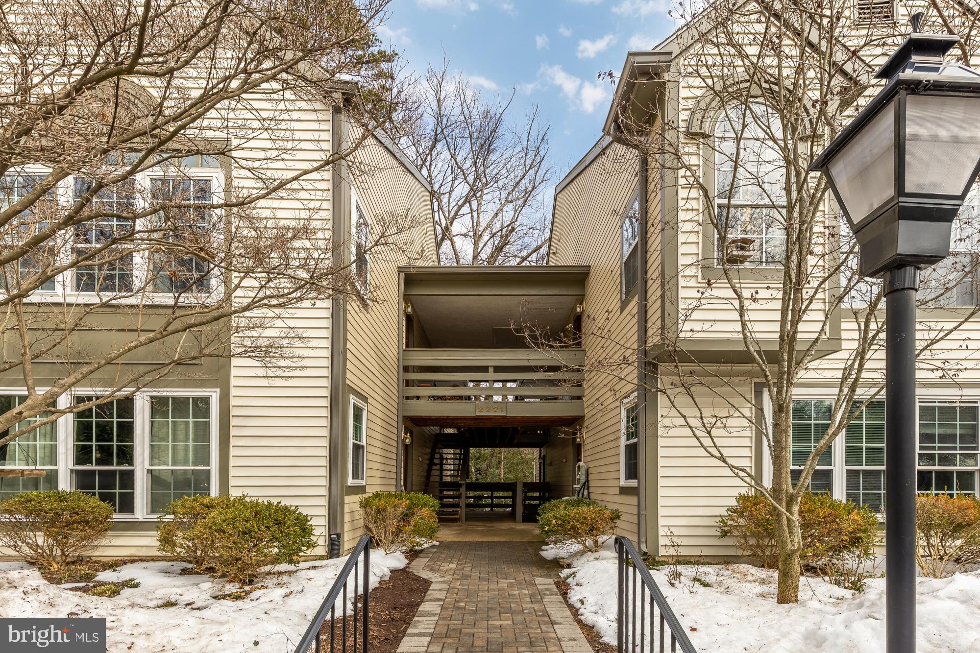 2221 Lovedale Lane, Unit 202B Reston, VA 20191 - Photo 26 of 27 a living room with a couch and a stove top oven
