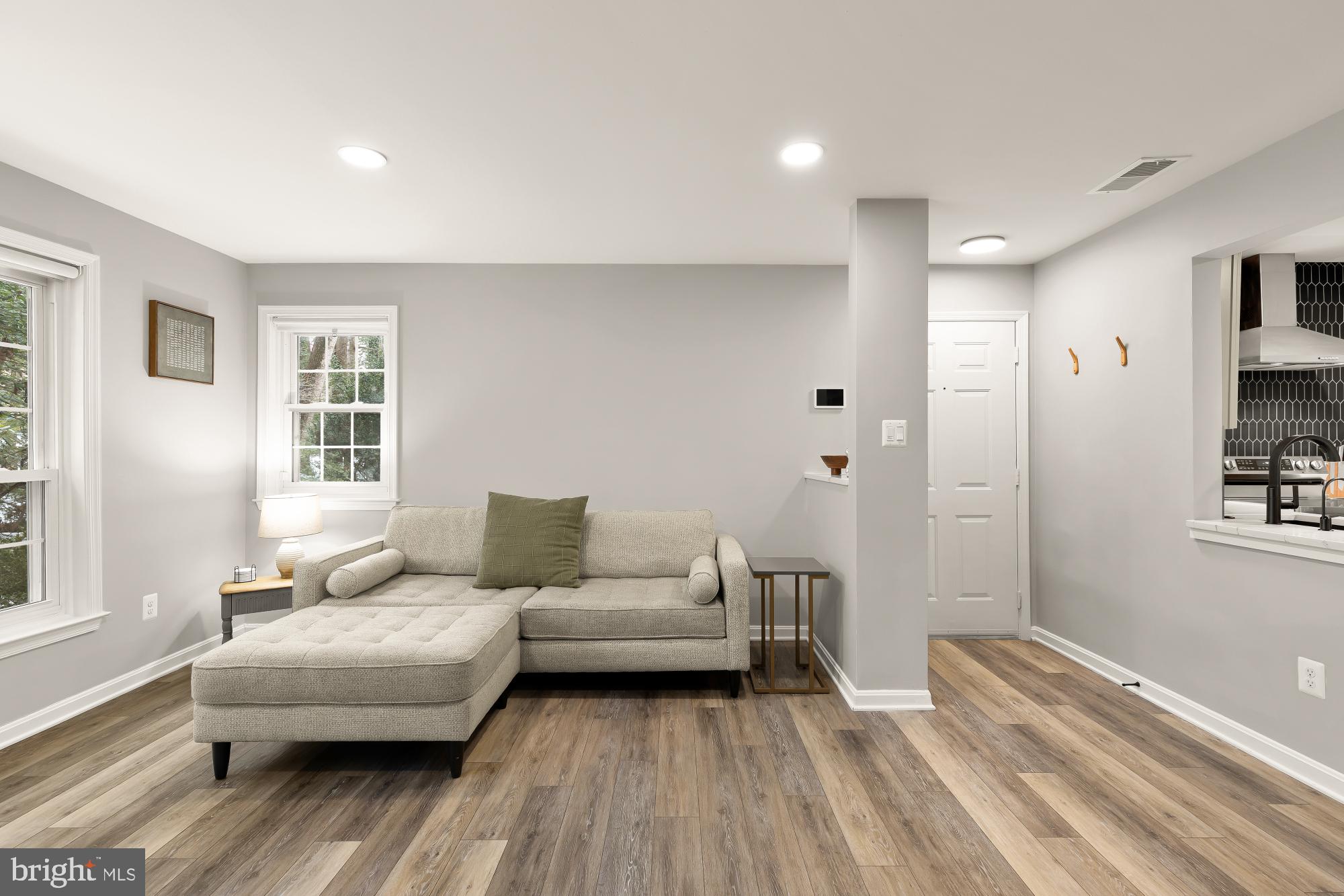 2221 Lovedale Lane, Unit 202B Reston, VA 20191 - Photo 3 of 27 a living room with furniture and a wooden floor