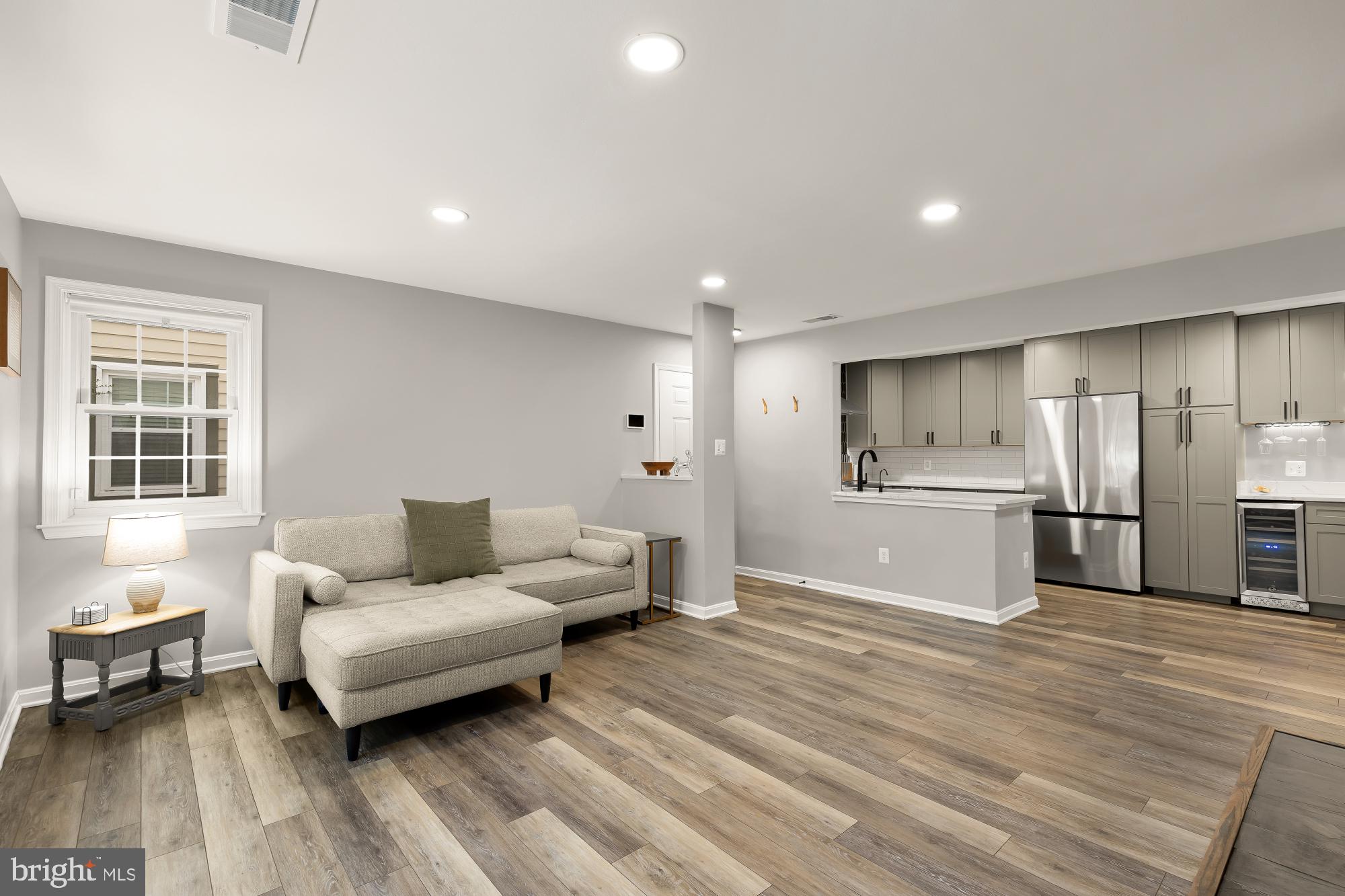 2221 Lovedale Lane, Unit 202B Reston, VA 20191 - Photo 5 of 27 a living room with furniture and a wooden floor