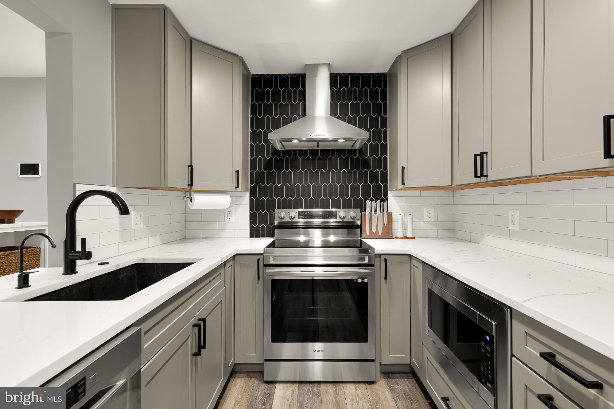2221 Lovedale Lane, Unit 202B Reston, VA 20191 - Photo 7 of 27 a kitchen with a stove and a sink