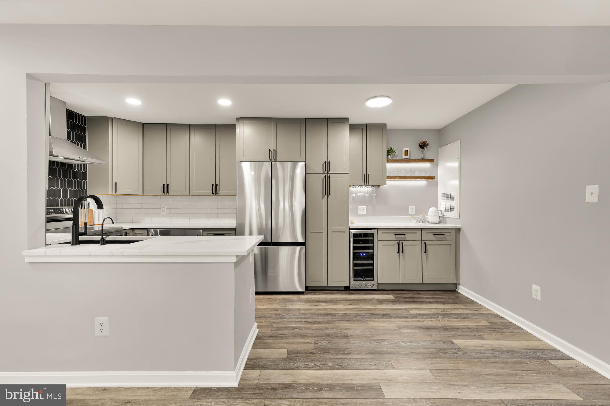 2221 Lovedale Lane, Unit 202B Reston, VA 20191 - Photo 9 of 27 a kitchen with a refrigerator sink and cabinets