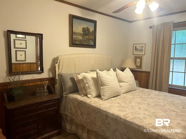 465 Rock Creek Road Wing, AL 36483 - Photo 7 of 15 Bedroom with multiple windows, ceiling fan, and crown molding