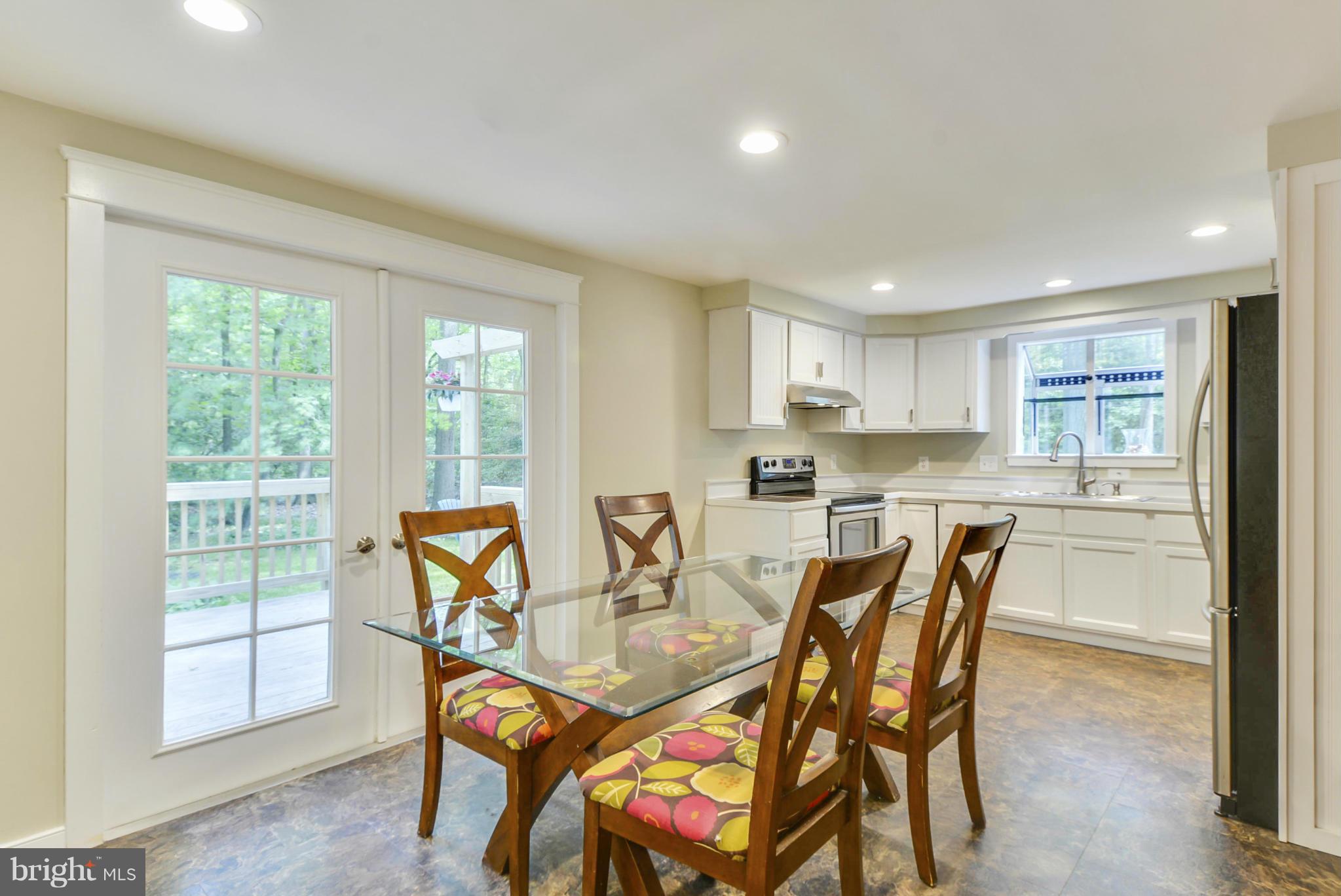 1665 Colbert Road Annapolis, MD 21409 - Photo 16 of 30 Dining Area Spilling Out to Grilling Deck