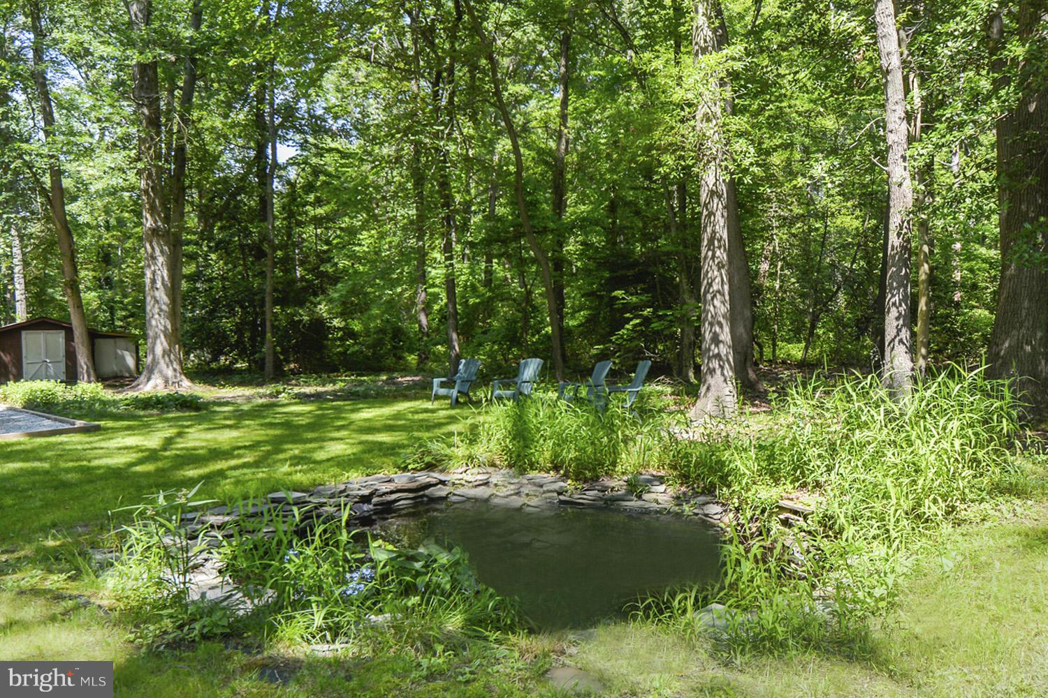 1665 Colbert Road Annapolis, MD 21409 - Photo 19 of 30 Tranquil Koi Pond Under Shade Tree Umbrellas