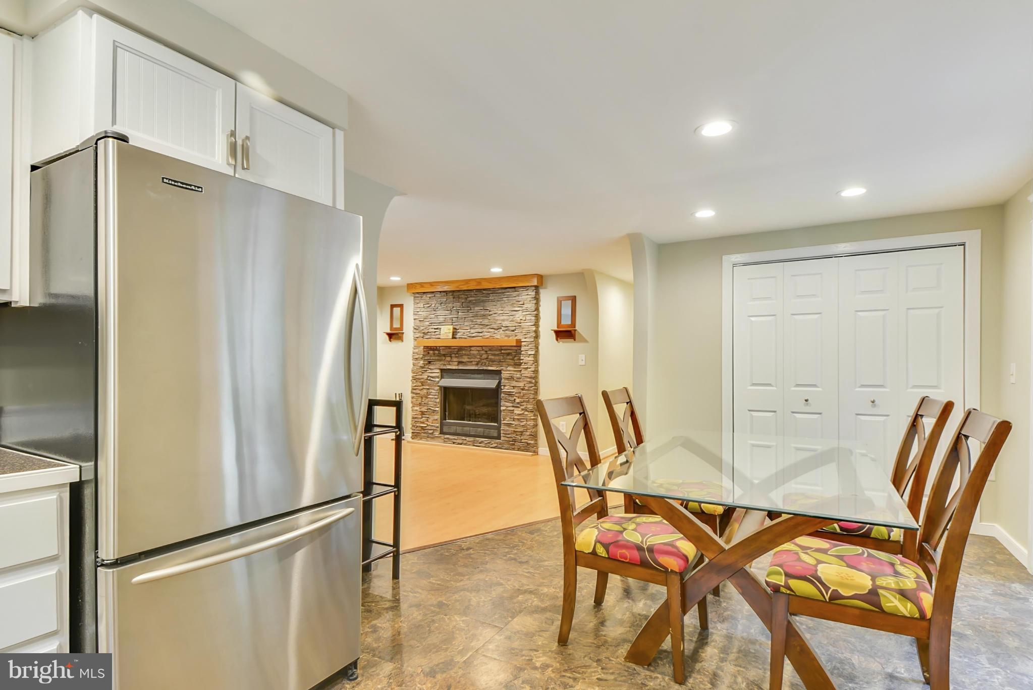 1665 Colbert Road Annapolis, MD 21409 - Photo 7 of 30 Kitchen / Dining Room Sharing Fireplace Ambiance