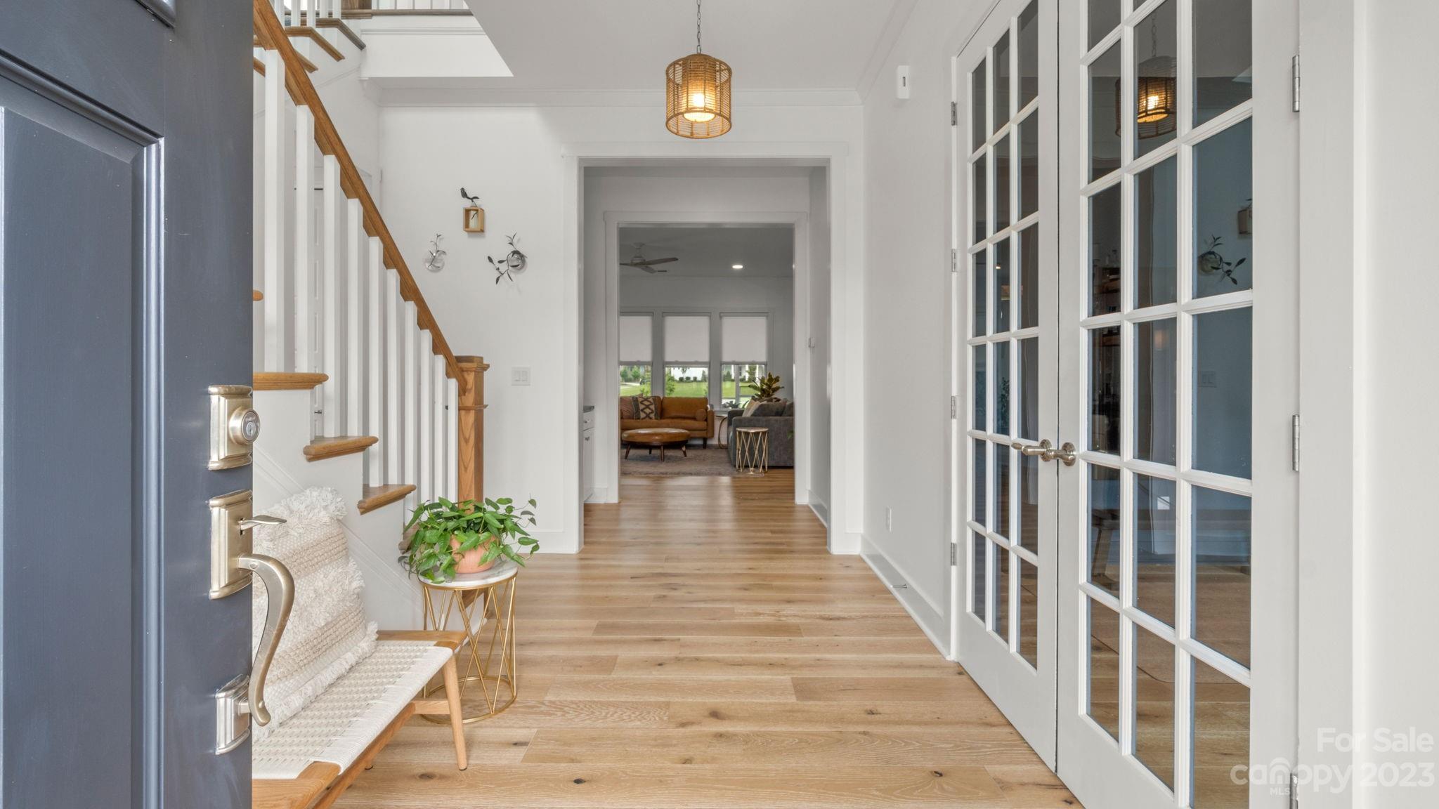 1111 Therns Ferry Drive Fort Mill, SC 29708 - Photo 3 of 39 a view of a hallway with wooden floor and stairs