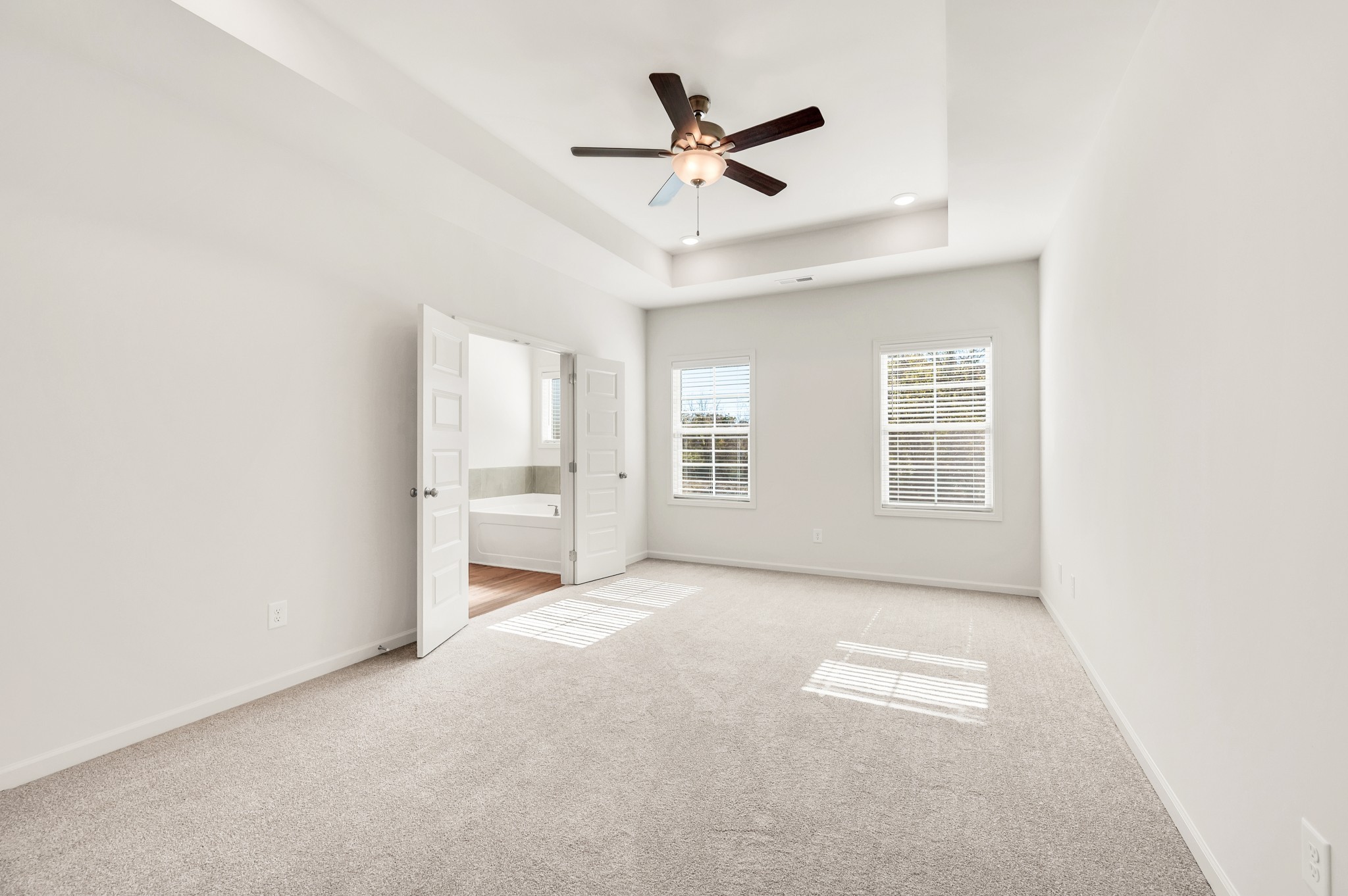 7107 Wiley Circle Fairview, TN 37062 - Photo 13 of 27 an empty room with windows and ceiling fan