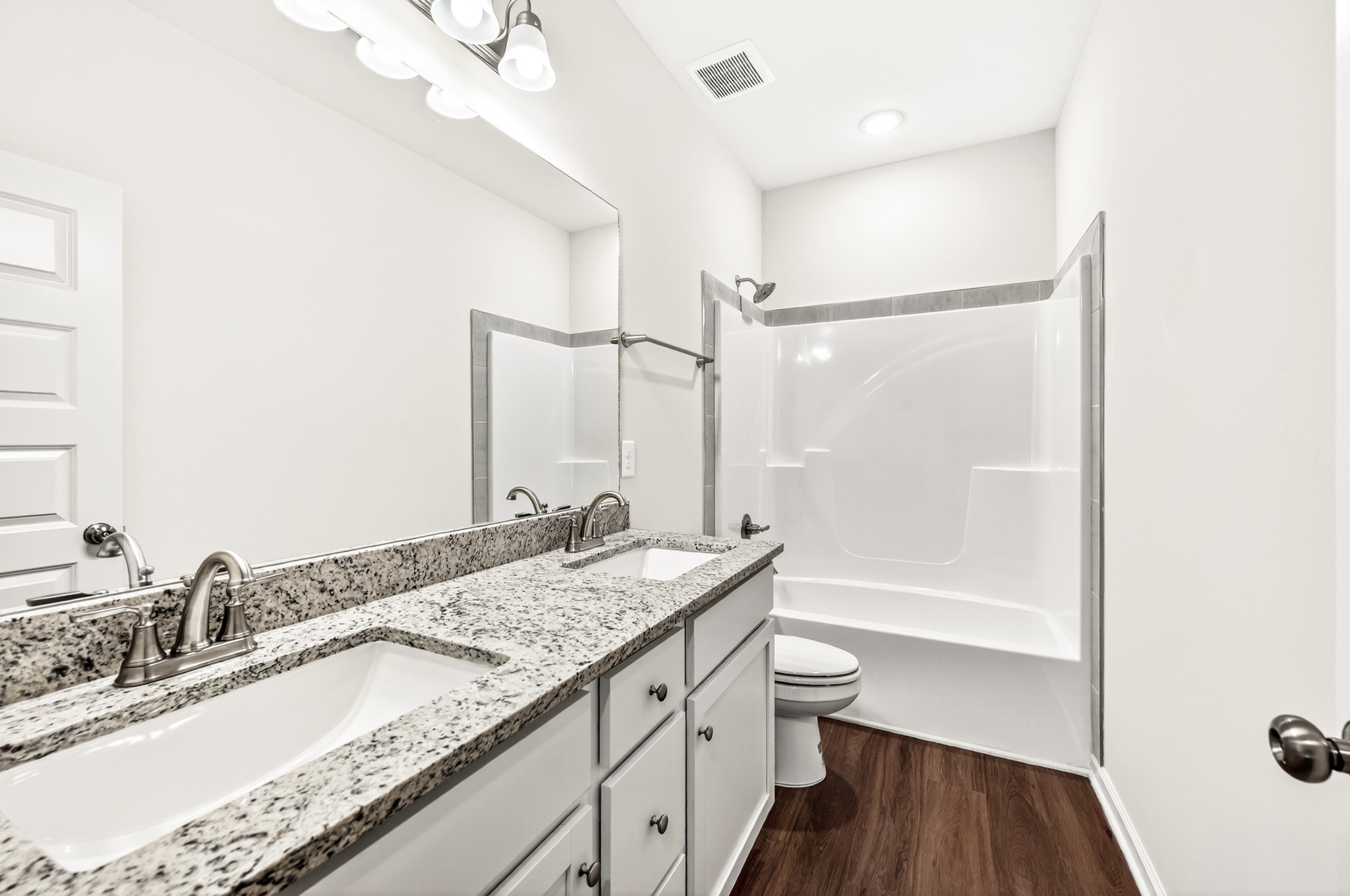 7107 Wiley Circle Fairview, TN 37062 - Photo 22 of 27 a bathroom with a granite countertop sink a toilet and shower