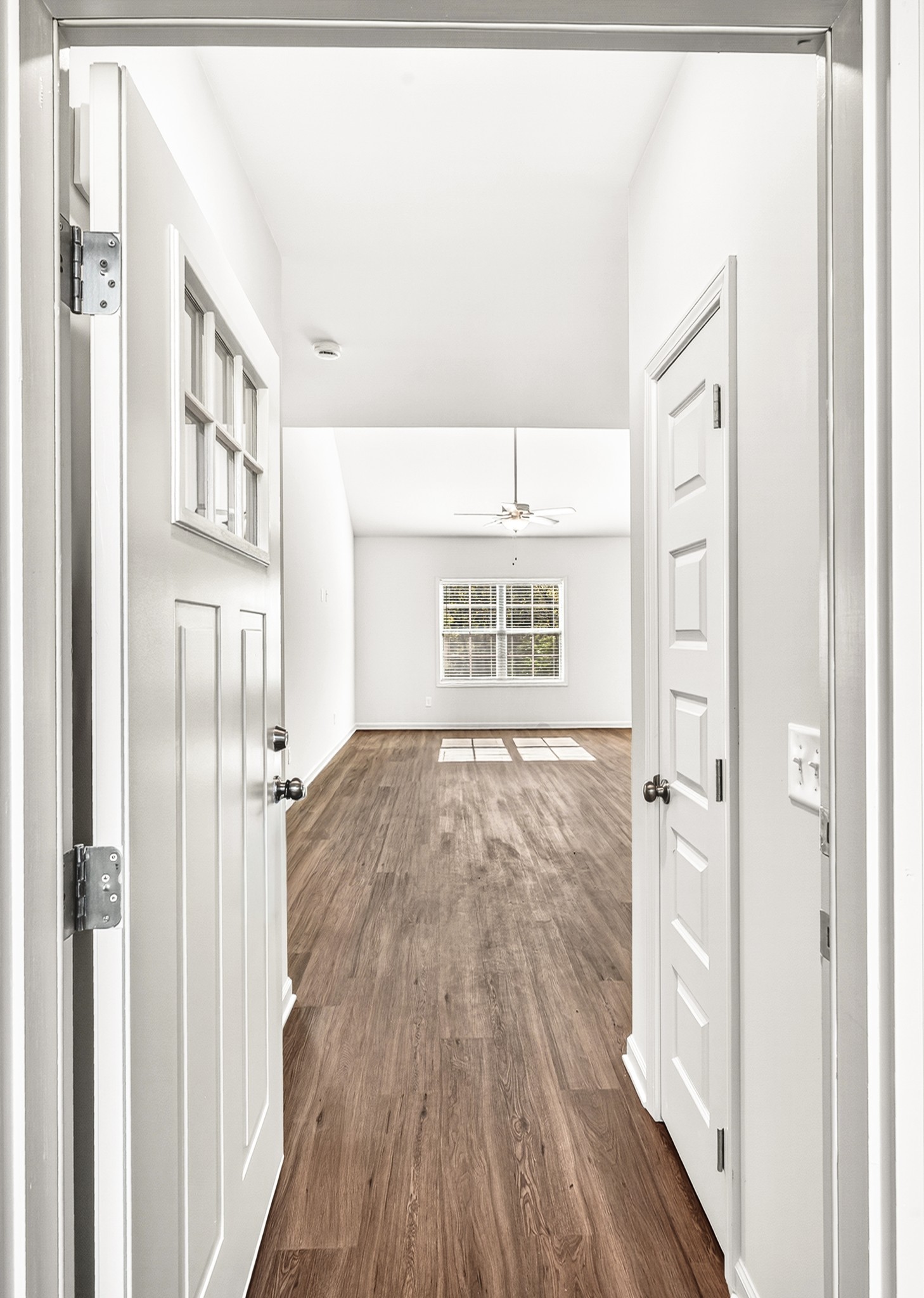 7107 Wiley Circle Fairview, TN 37062 - Photo 4 of 27 a view of an empty room with wooden floor and a window