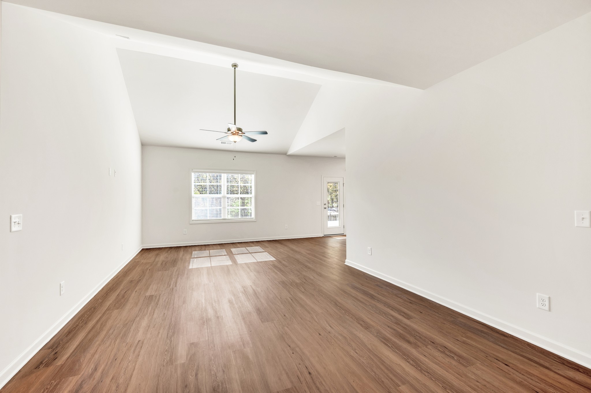 7107 Wiley Circle Fairview, TN 37062 - Photo 5 of 27 an empty room with wooden floor and windows