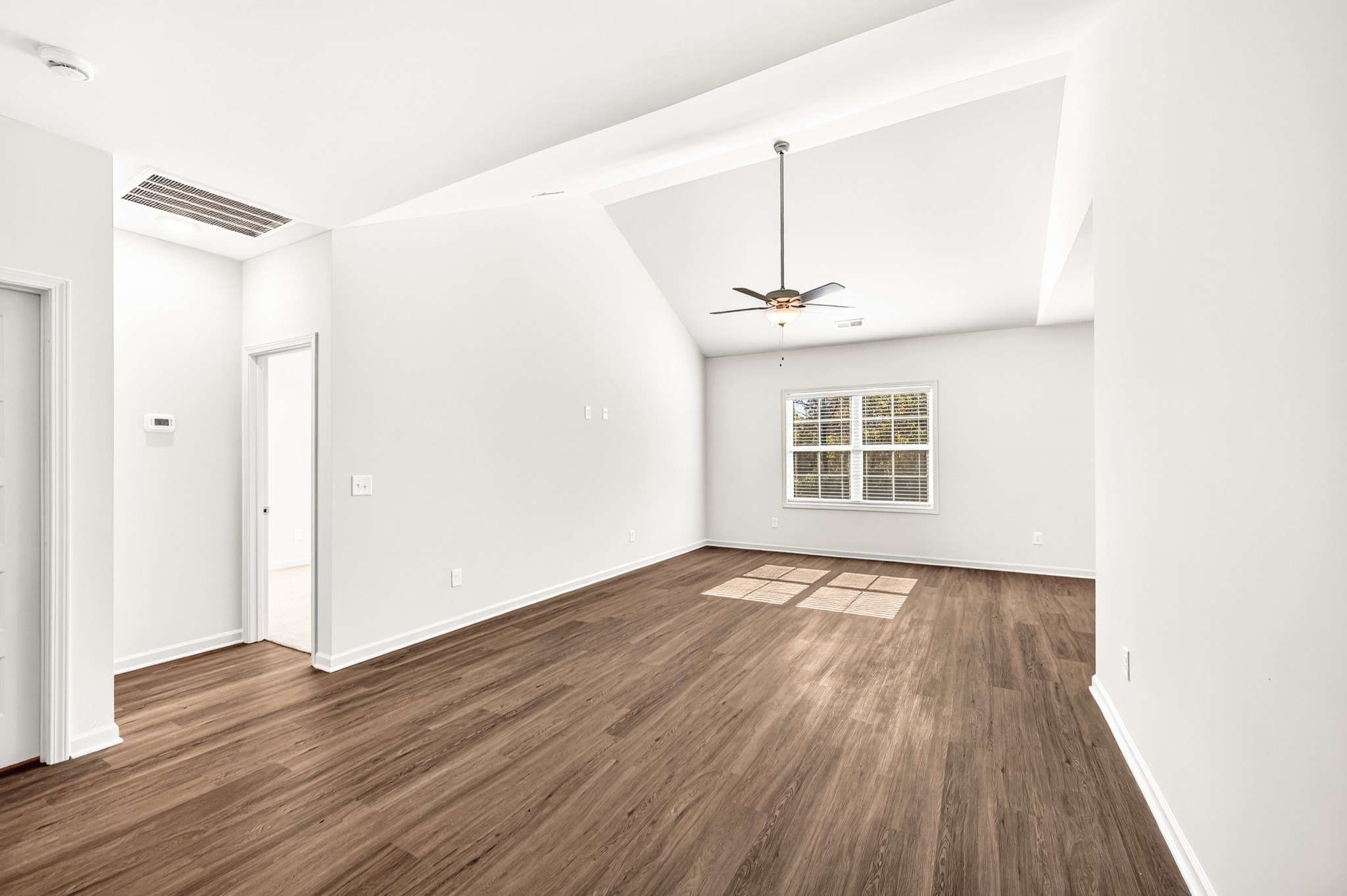 7107 Wiley Circle Fairview, TN 37062 - Photo 6 of 27 a view of an empty room with wooden floor and a window