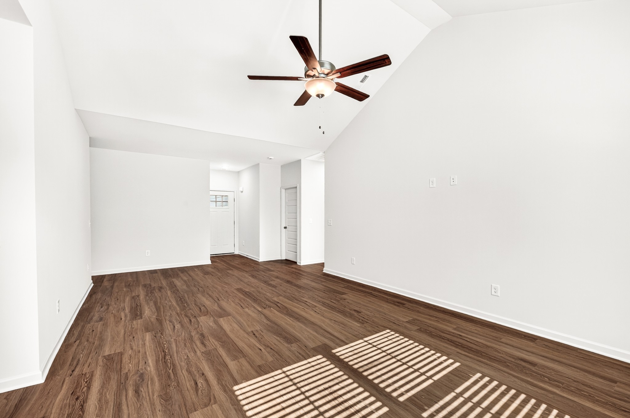 7107 Wiley Circle Fairview, TN 37062 - Photo 8 of 27 a view of a room with wooden floor and ceiling fan