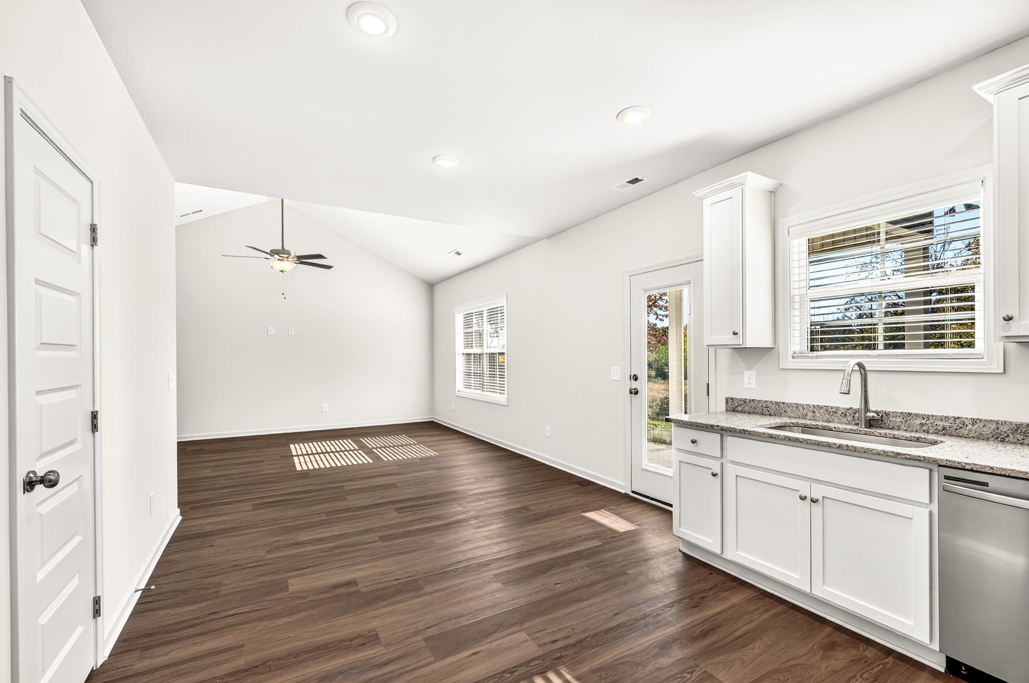 7107 Wiley Circle Fairview, TN 37062 - Photo 10 of 27 a view of a kitchen with a sink dishwasher a refrigerator and wooden floor