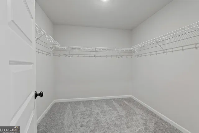 a bathroom with a double vanity sink mirror and shower