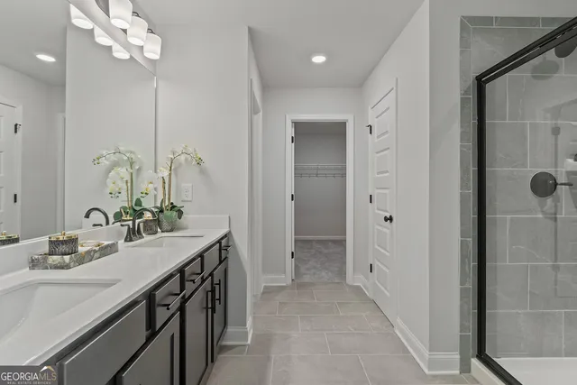 a bathroom with a sink double vanity and a mirror
