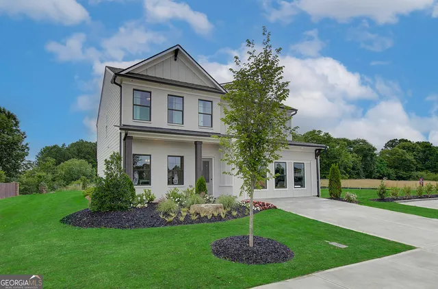 a front view of a house with a yard