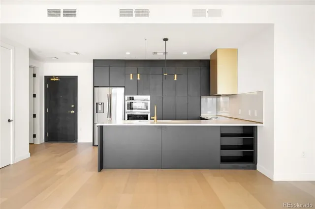a living room with furniture and a dresser