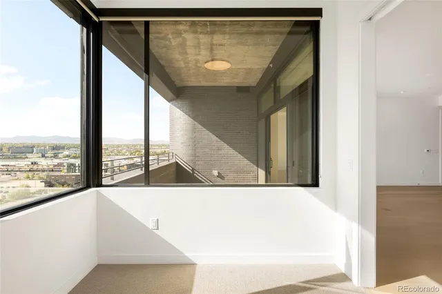 a view of a living room with a large window