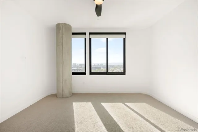 a view of a room with walk in closet and wooden floor