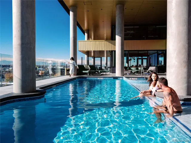 a view of a city from a dining room with furniture