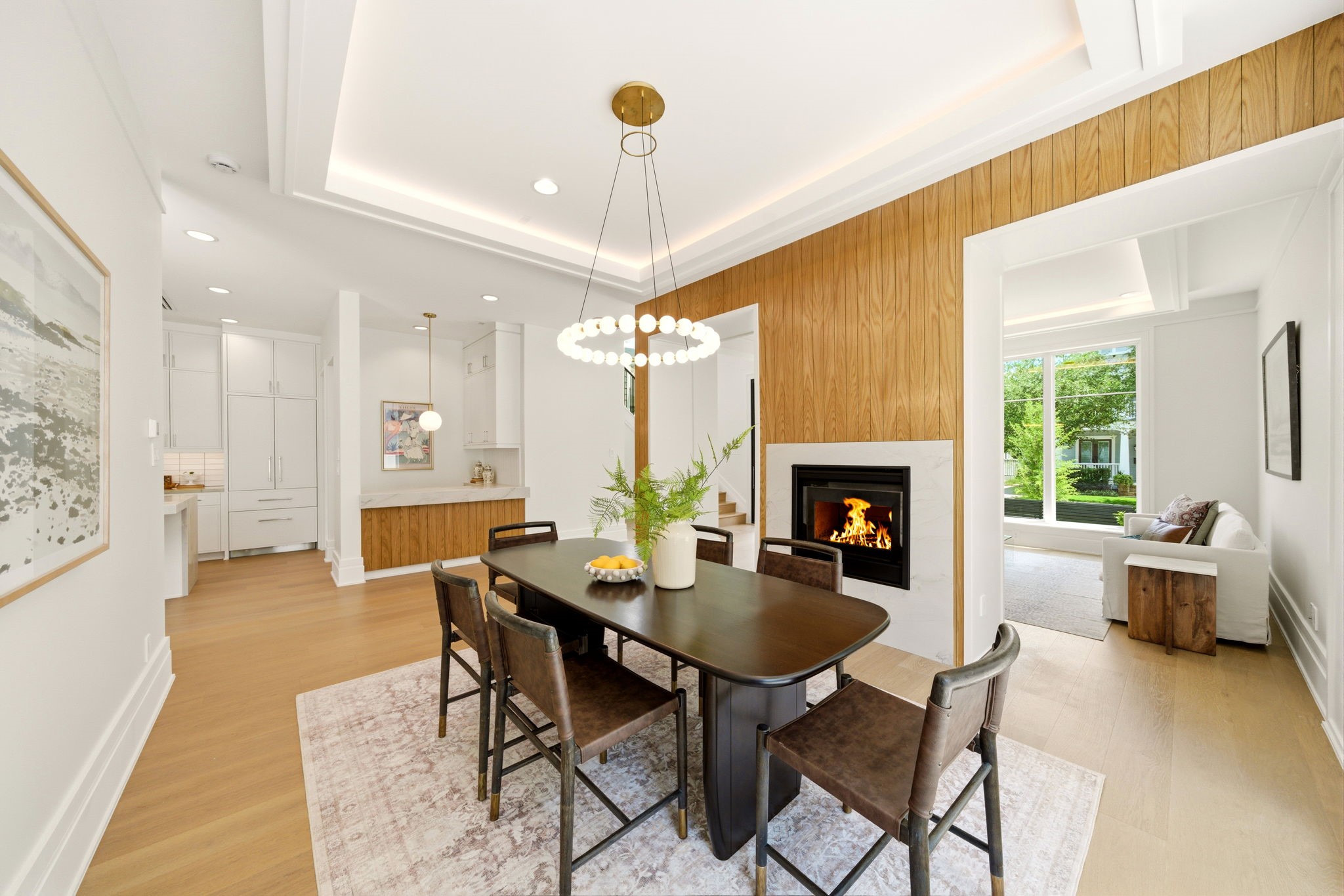 1023 Euclid Street Houston, TX 77009 - Photo 4 of 50 Open flow dining room showcasing intricate oak detailing and striking fireplace.