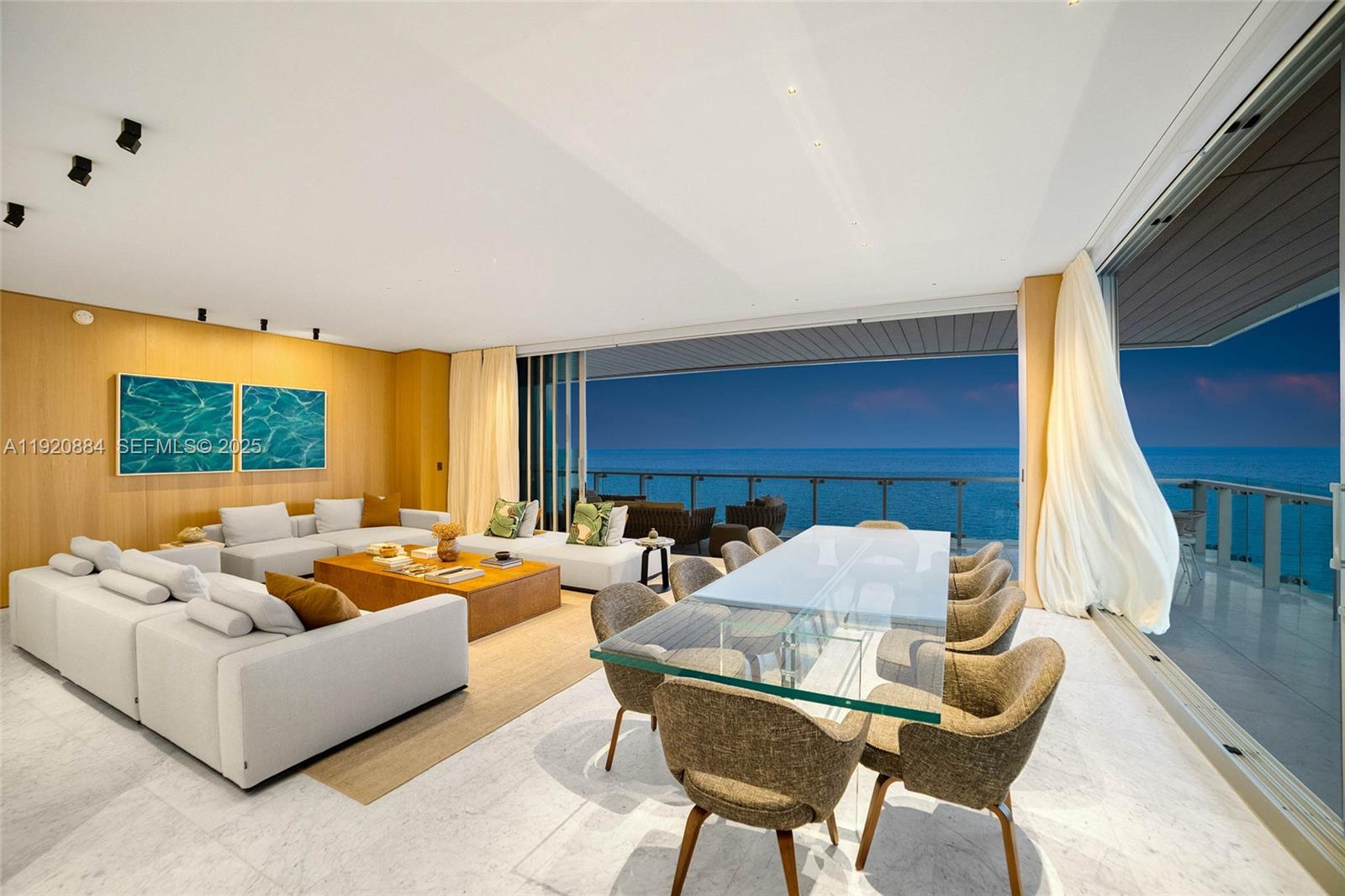 5775 Collins Avenue, Unit 1501 Miami Beach, FL 33140 - Photo 3 of 77 a living room with furniture and a fireplace