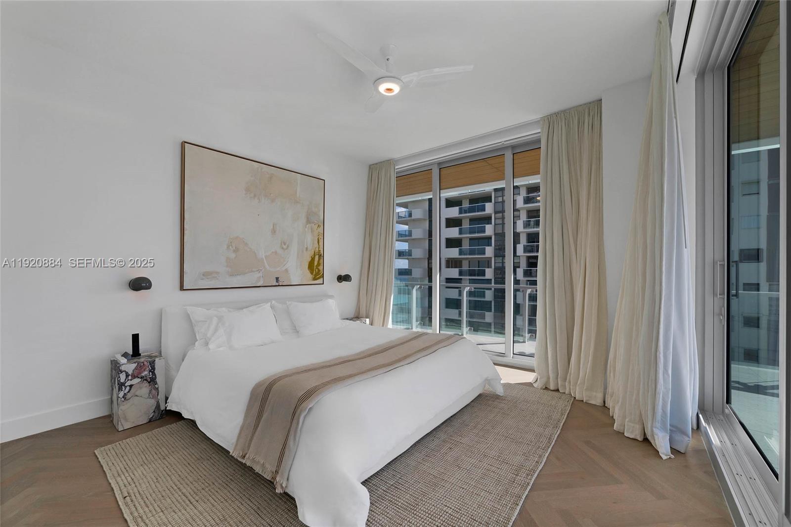 5775 Collins Avenue, Unit 1501 Miami Beach, FL 33140 - Photo 37 of 77 a bedroom with a large bed and a window