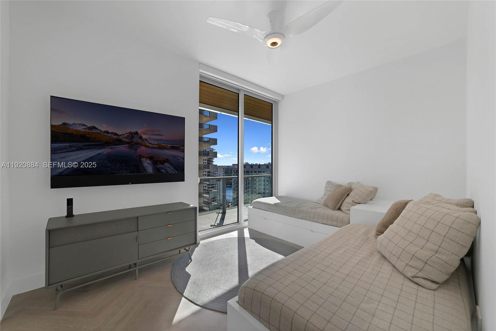 5775 Collins Avenue, Unit 1501 Miami Beach, FL 33140 - Photo 47 of 77 a living room with furniture and a flat screen tv