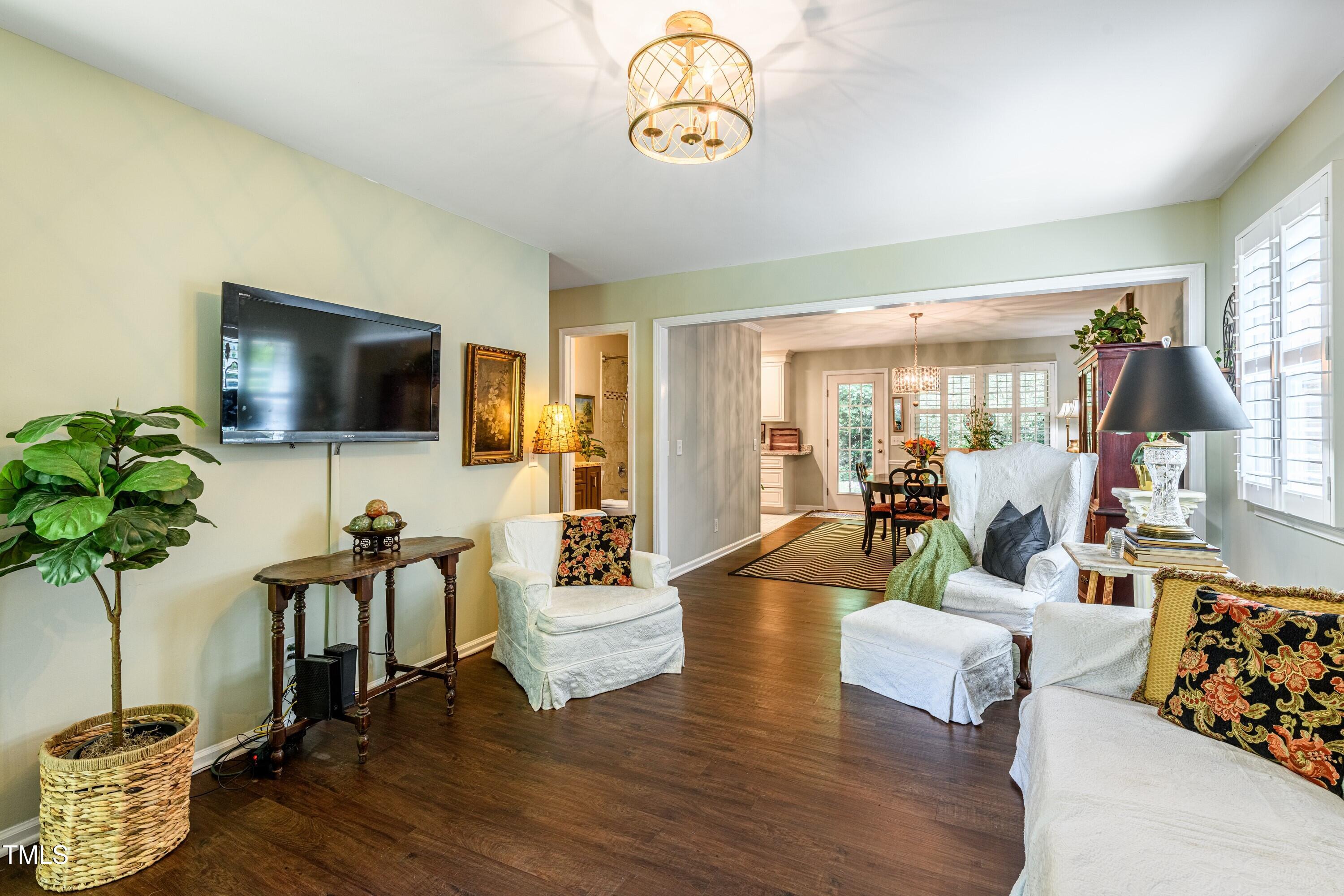 1008 Mockingbird Drive Raleigh, NC 27615 - Photo 11 of 32 a living room with furniture and a flat screen tv