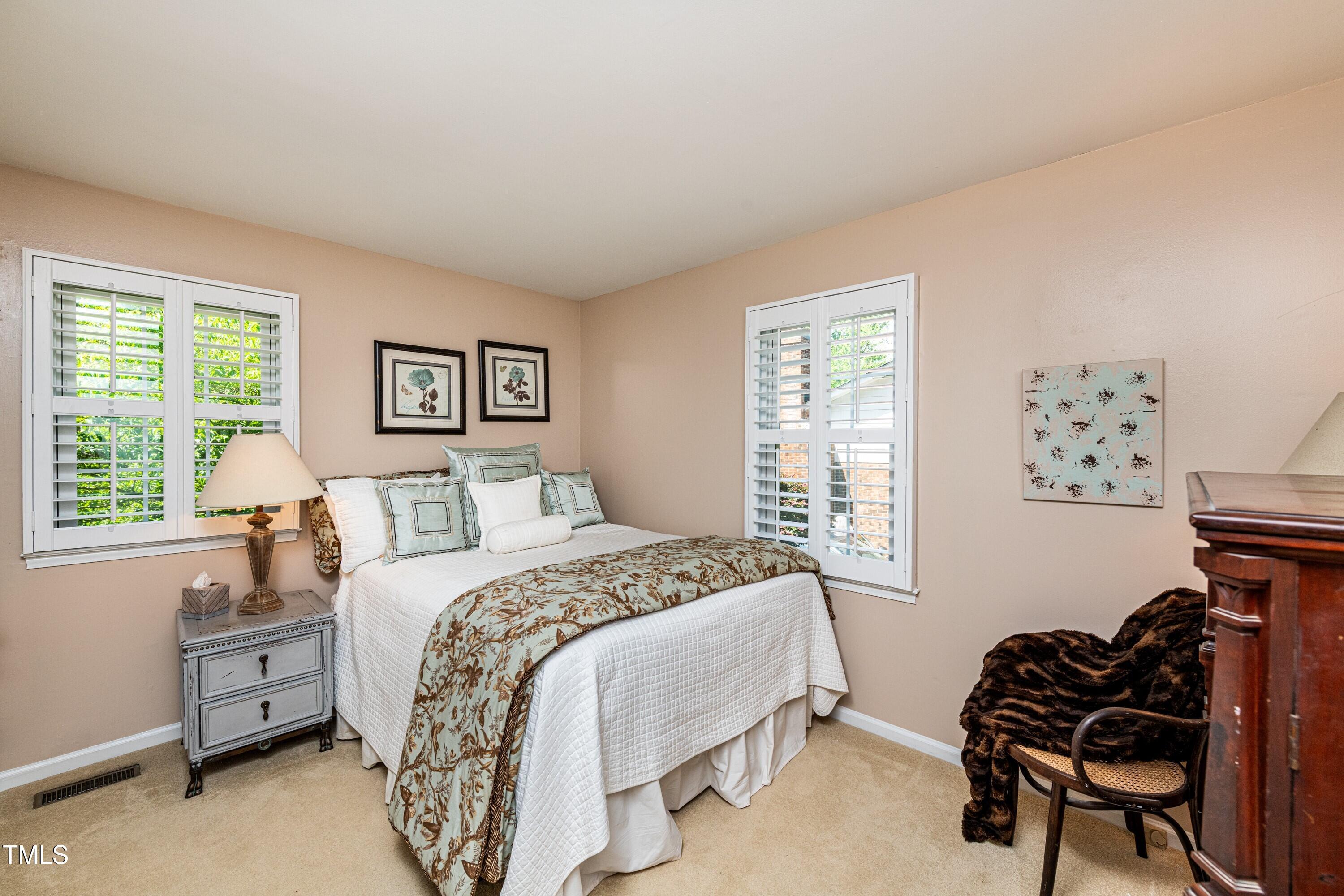 1008 Mockingbird Drive Raleigh, NC 27615 - Photo 24 of 32 a bedroom with a bed and a window