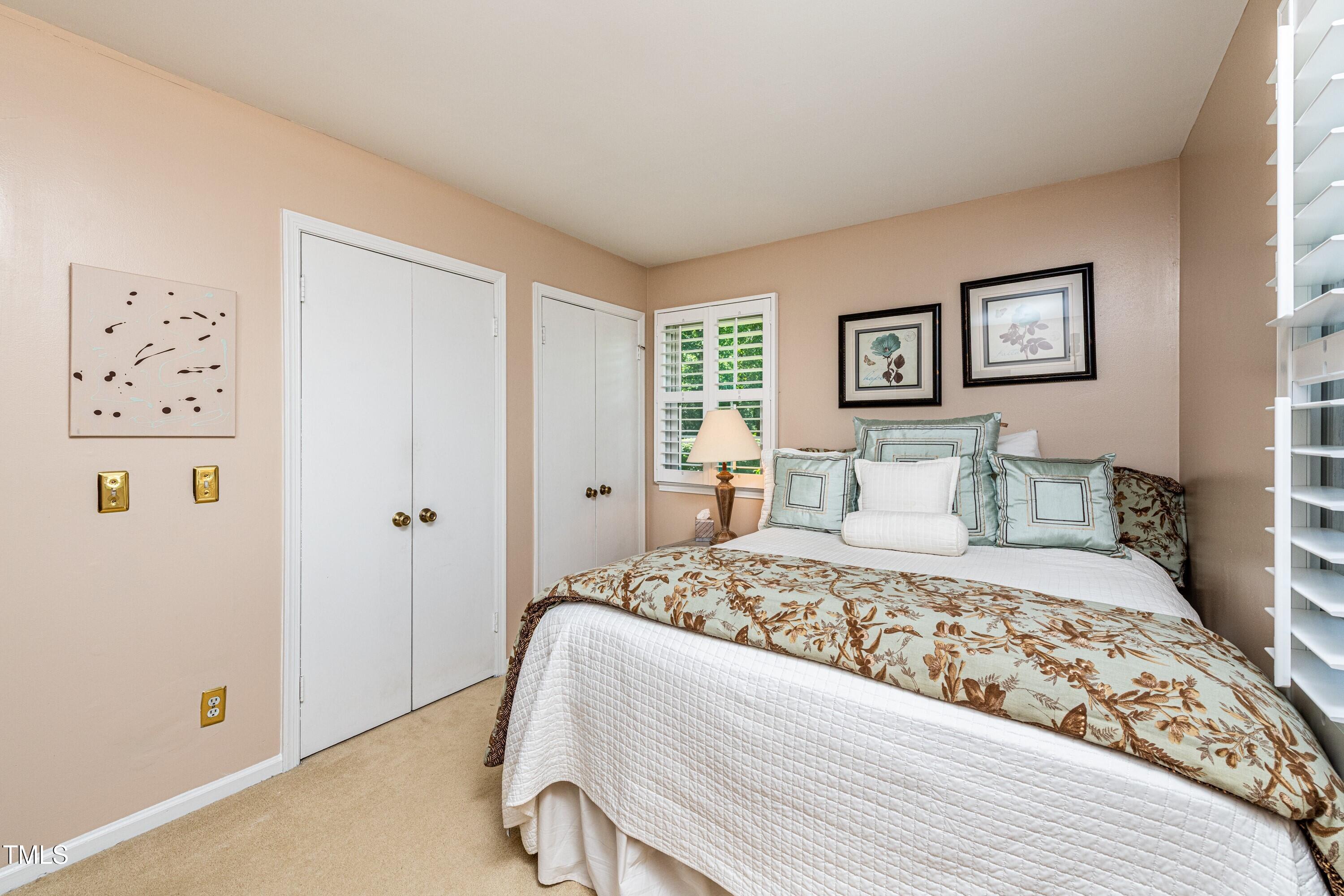 1008 Mockingbird Drive Raleigh, NC 27615 - Photo 25 of 32 a bedroom with a large bed and a window
