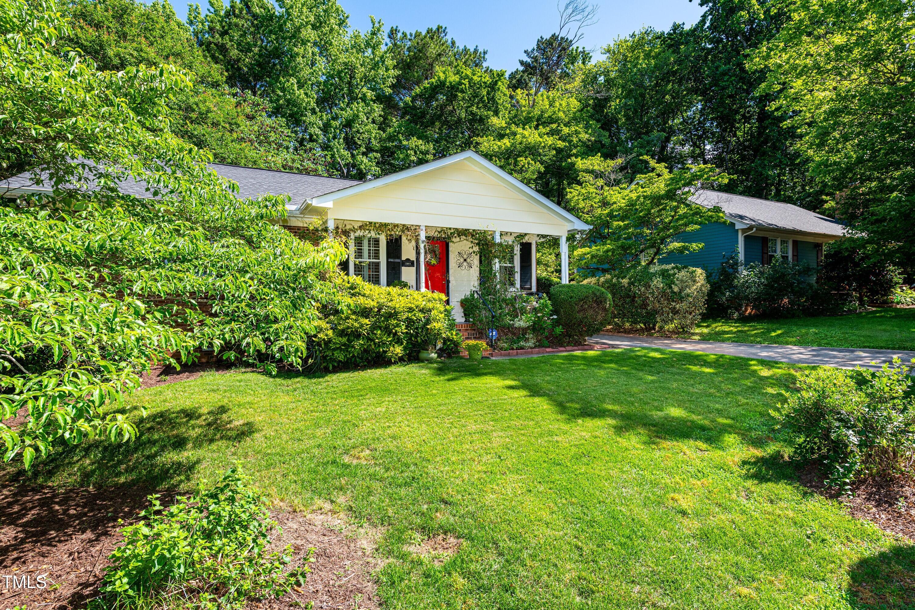 1008 Mockingbird Drive Raleigh, NC 27615 - Photo 31 of 32 a front view of a house with garden