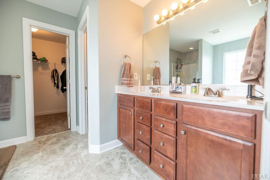 107 Rosedale Court Moyock, NC 27958 - Photo 18 of 31 Master vanity has ample lighting
