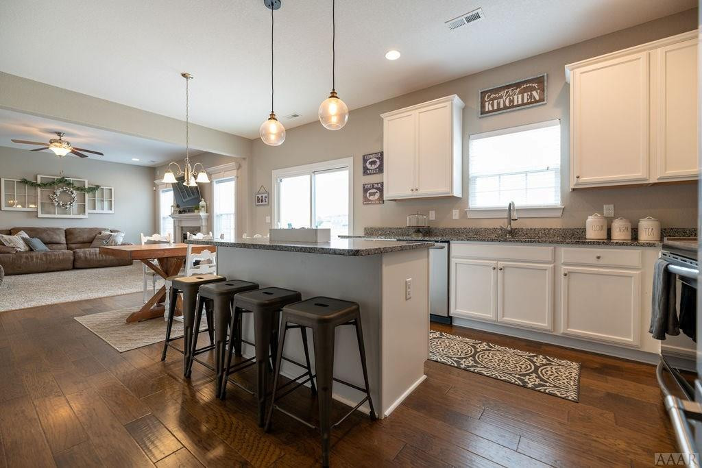 107 Rosedale Court Moyock, NC 27958 - Photo 10 of 31 Island that accomodates seating for 4