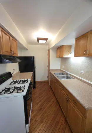 a kitchen with a stove and a sink
