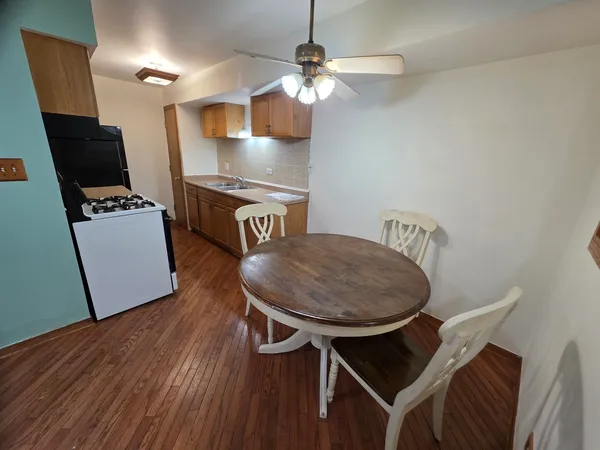 a workspace with furniture and wooden floor