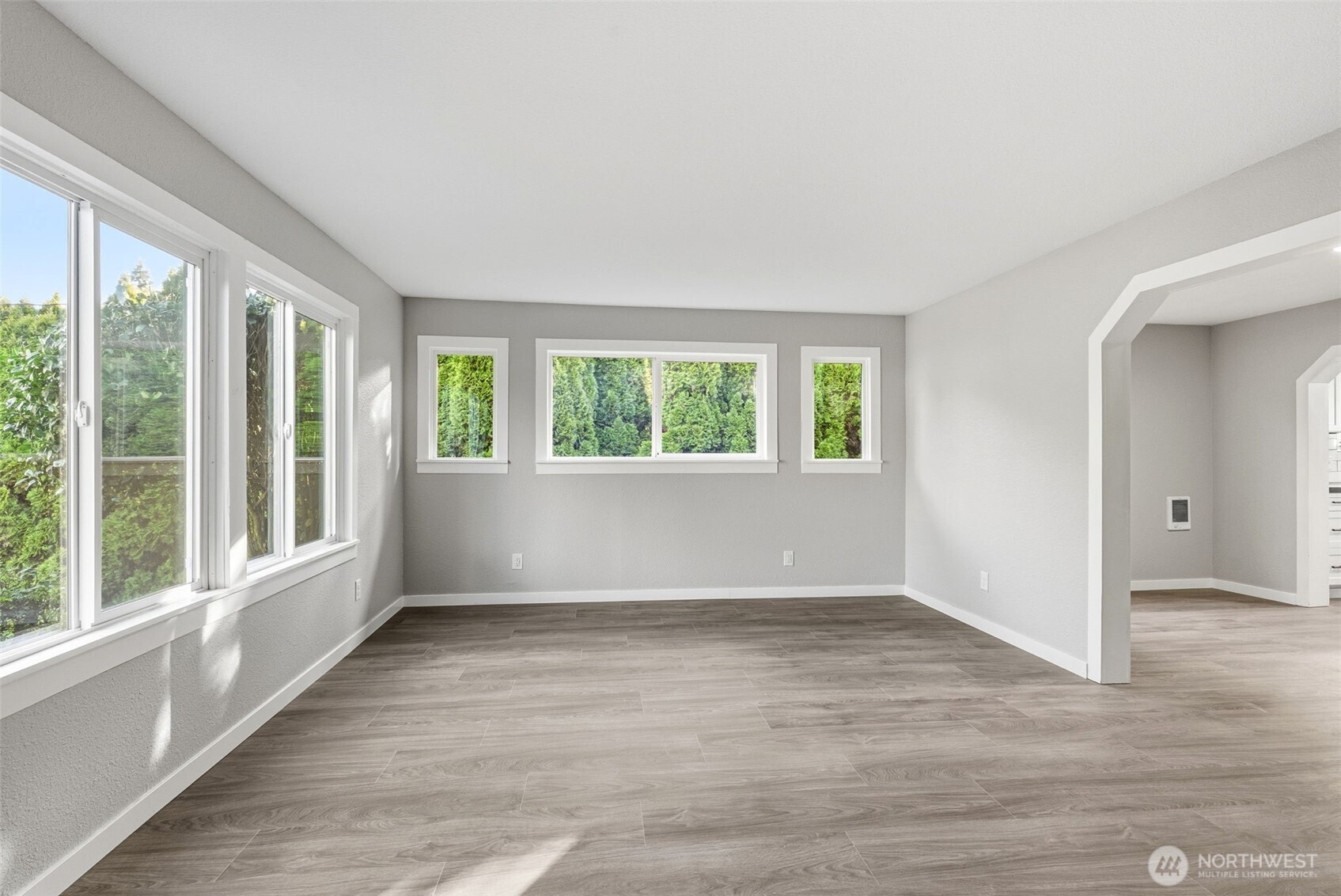 508 Nevada Drive Longview, WA 98632 - Photo 12 of 29 an empty room with wooden floor and windows