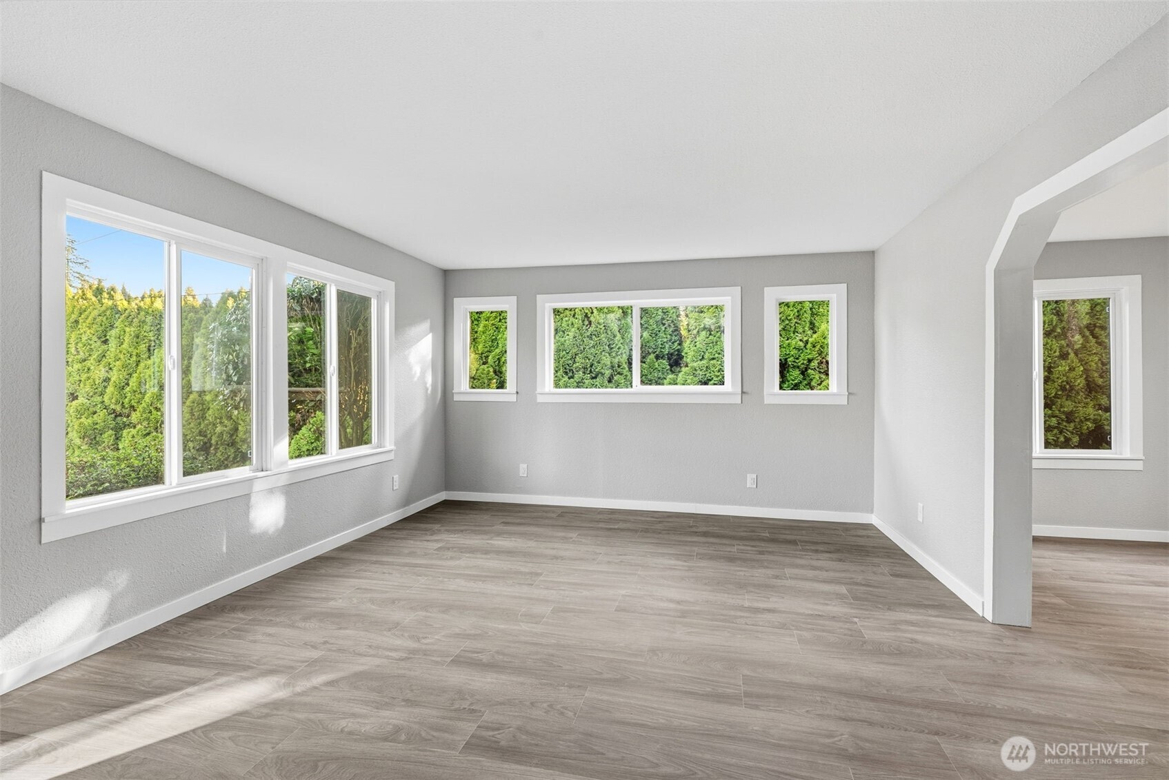 508 Nevada Drive Longview, WA 98632 - Photo 13 of 29 a view of an empty room with wooden floor and a window