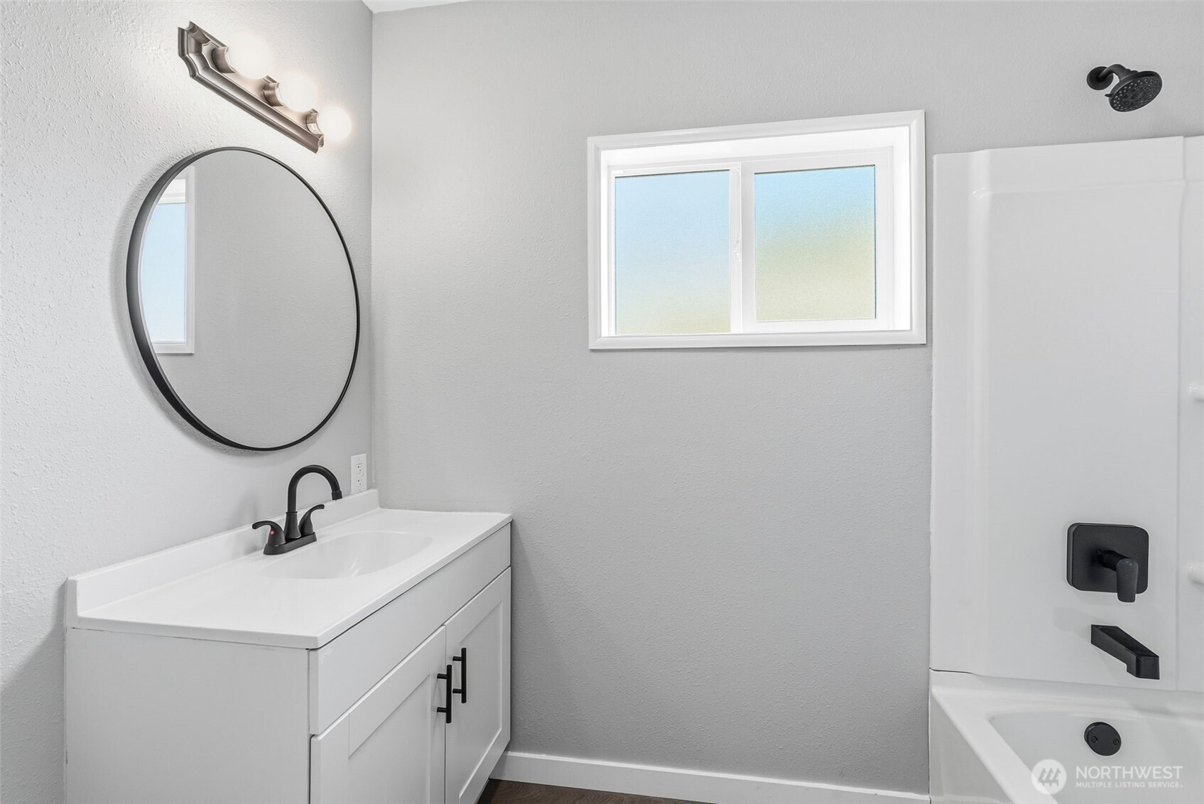 508 Nevada Drive Longview, WA 98632 - Photo 16 of 29 a bathroom with a sink a mirror and shower