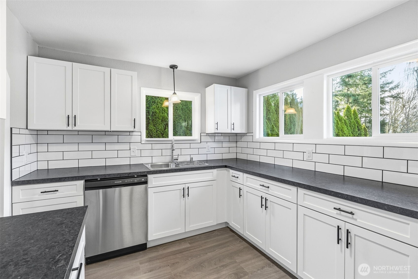 508 Nevada Drive Longview, WA 98632 - Photo 9 of 29 a kitchen with a sink stove and cabinets