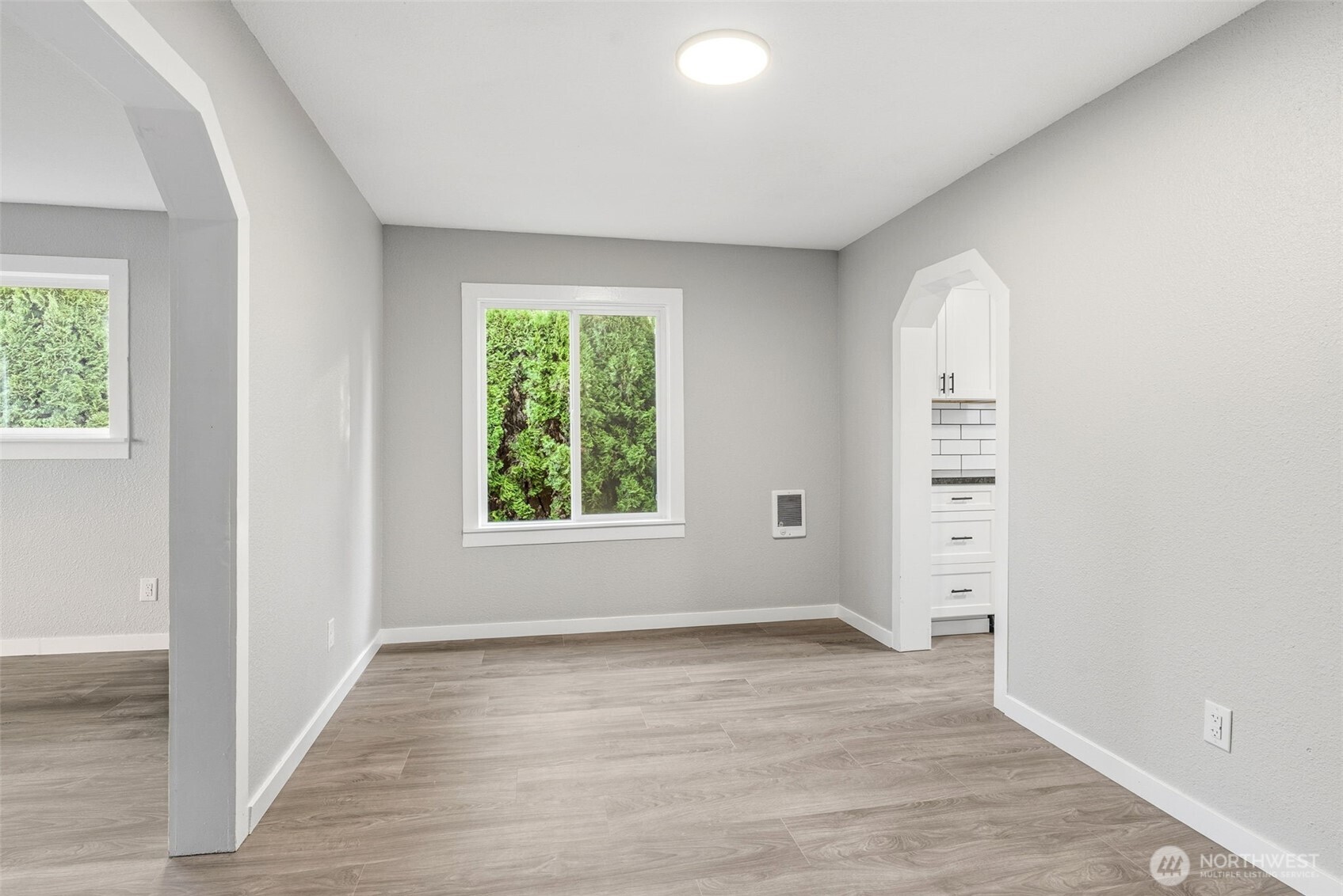 508 Nevada Drive Longview, WA 98632 - Photo 10 of 29 an empty room with wooden floor and windows
