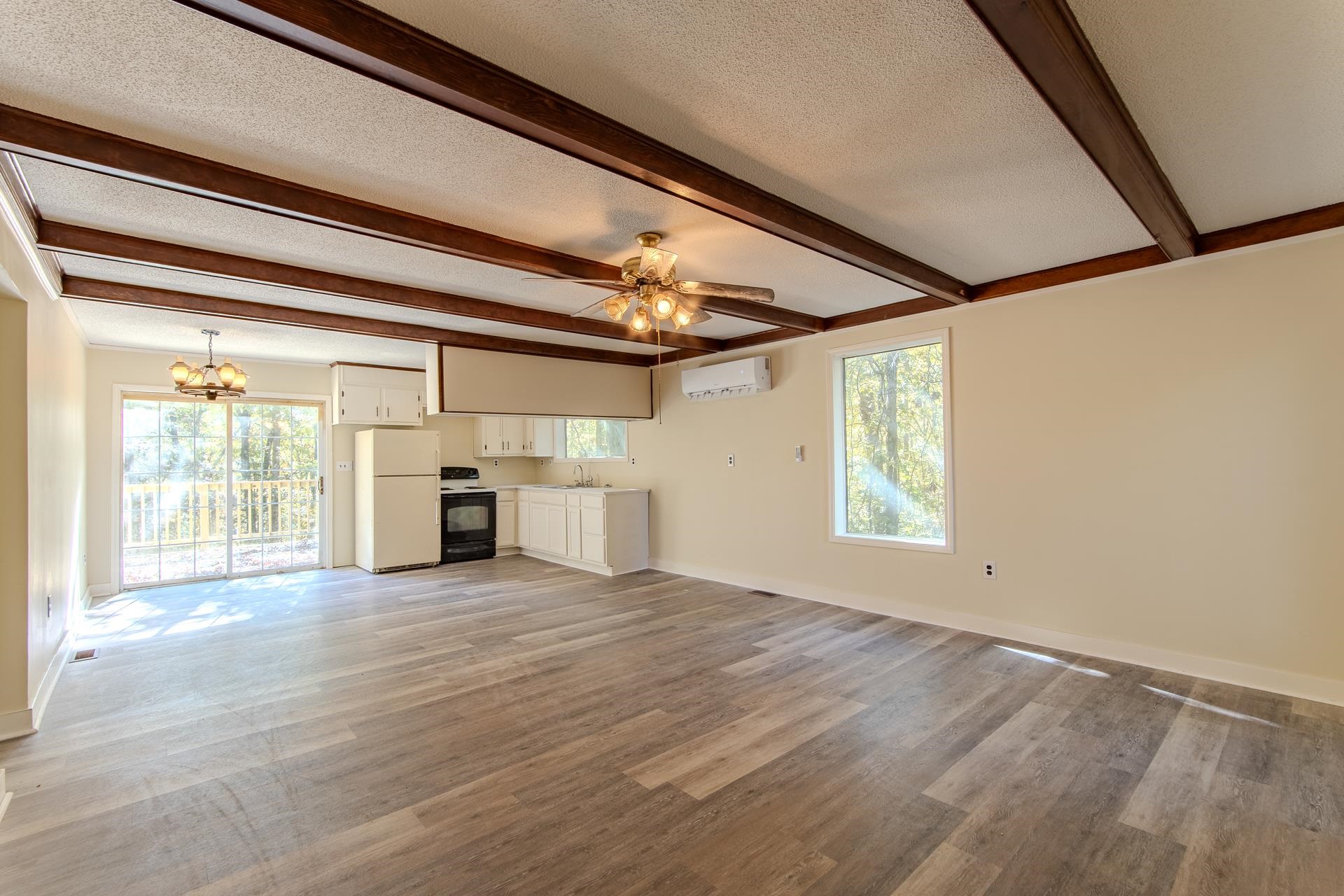 35 Trail Lane Savannah, TN 38372 - Photo 11 of 39 a view of a livingroom with wooden floor and fireplace